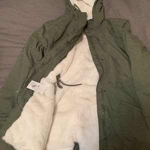 2 coats Green coat large Burgundy coat medium 50.00 each